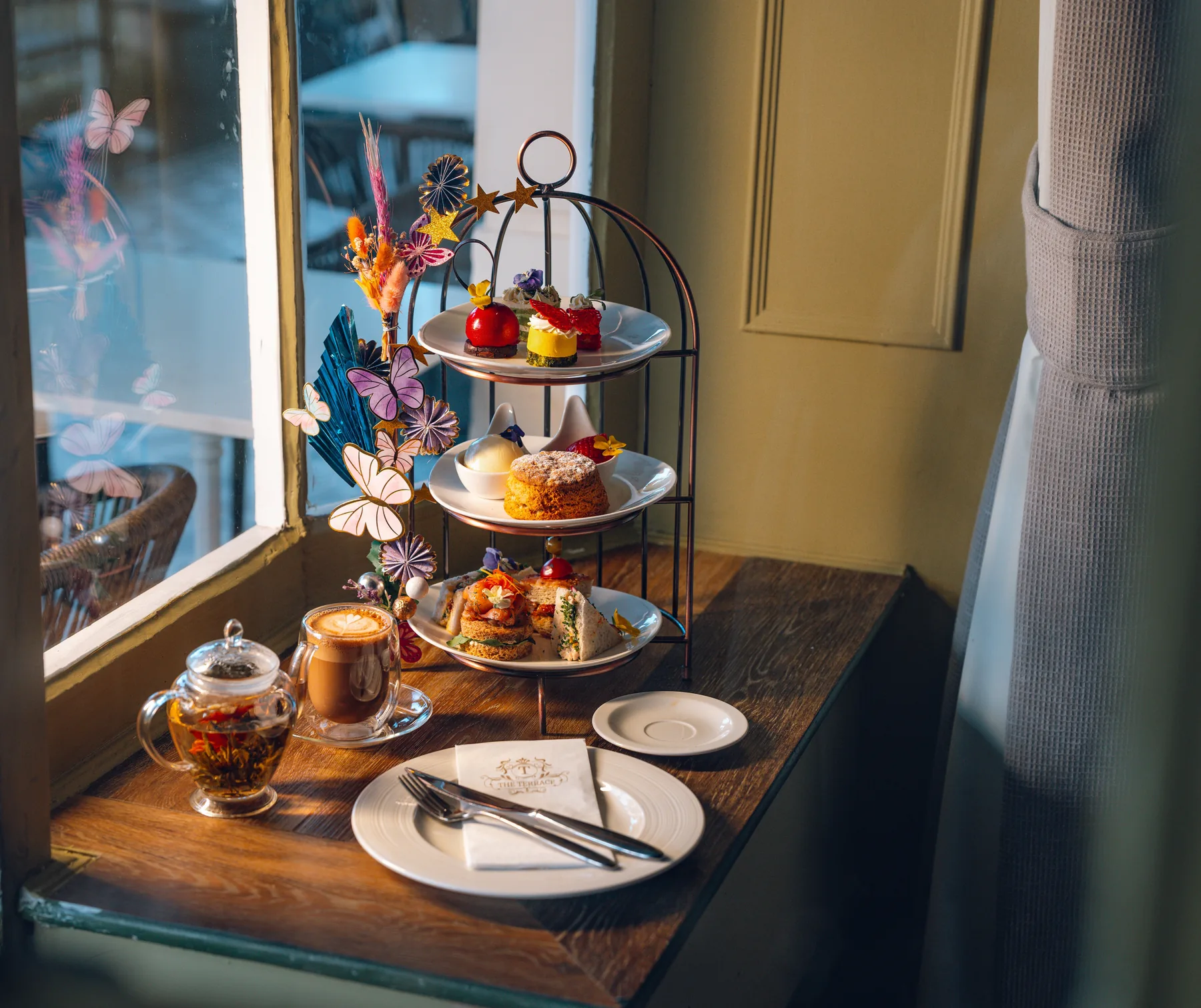 Three-tier afternoon tea stand with patisserie at The Terrace
