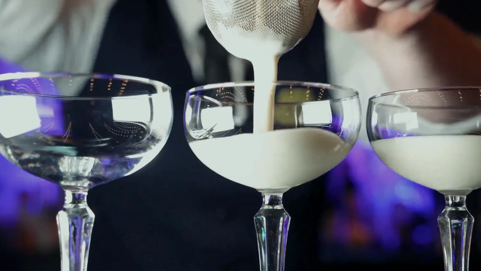 A bartender pouring cocktails at The Terrace